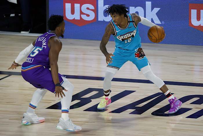 Donovan Mitchell (45) and Ja Morant (12) go toe-to-toe during last years matchup in the "NBA Bubble"